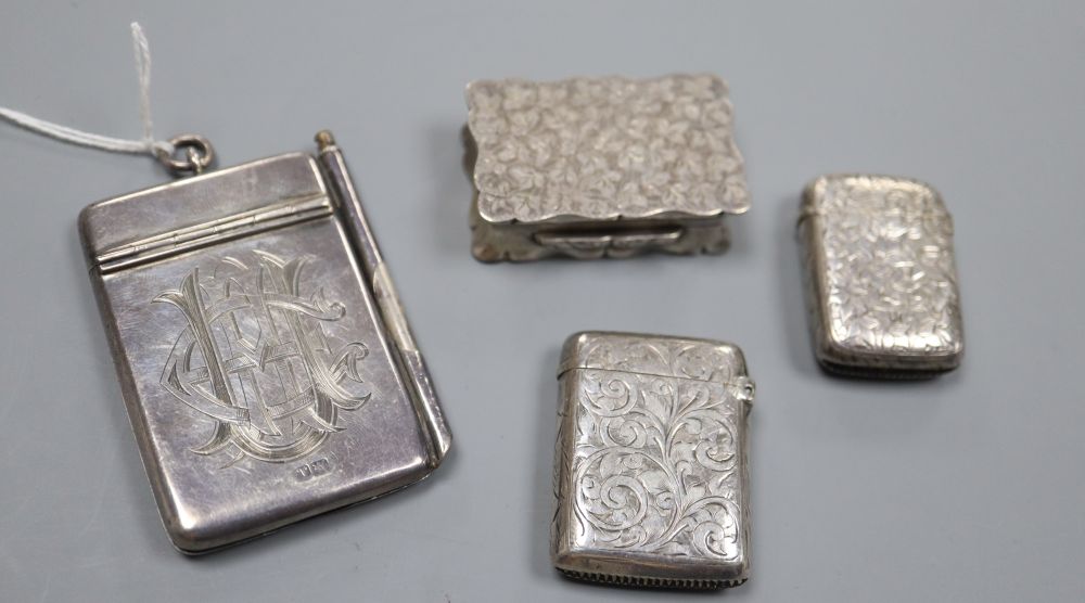 Two early 20th century silver vesta case, a silver snuff box and a silver aide memoire.